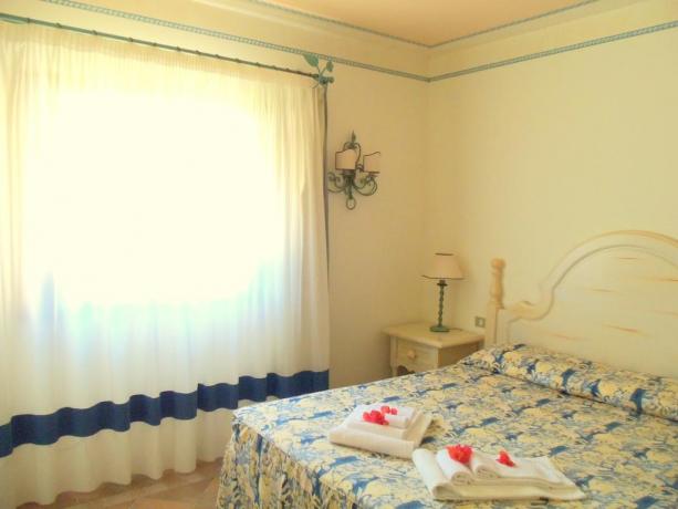 Biancheria da letto camera residence vicino Porto Cervo