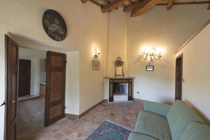 Soggiorno con camino, appartamento vacanza
