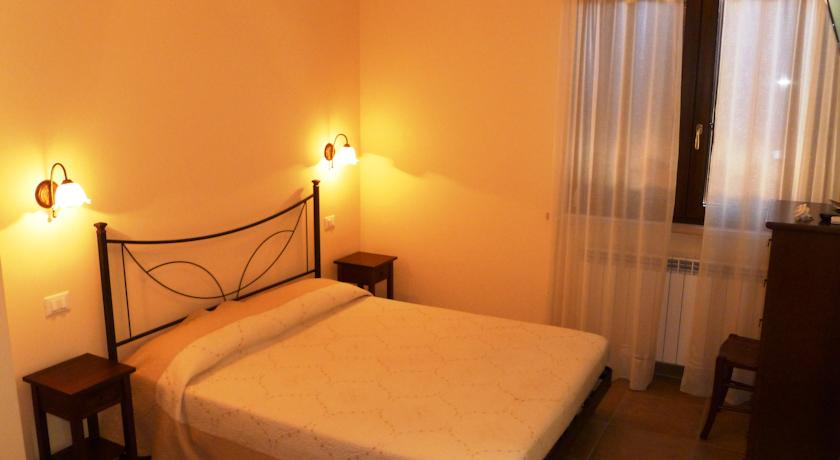 Camera Classic con letto in ferro battuto