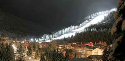 Skiing at night, night-lit slopes in Carezza