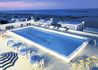 Hotel with swimmingpool near the sea and beach
