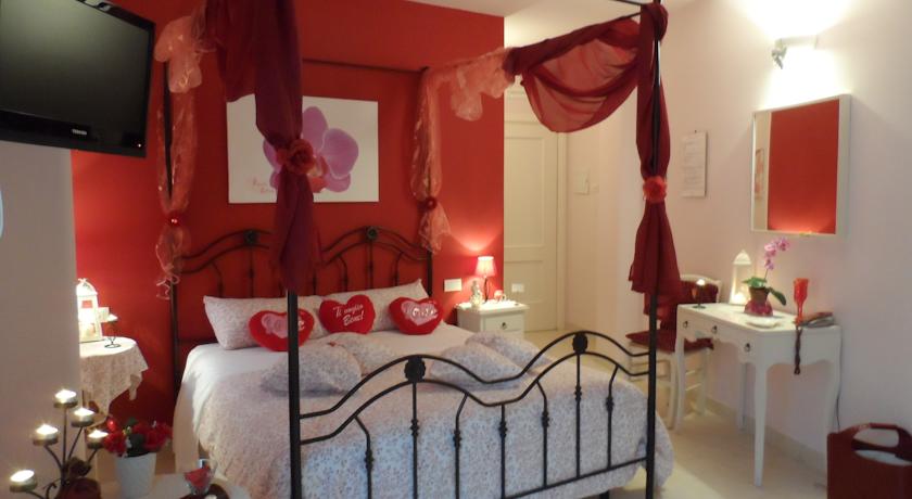 Camera Orchidea con letto a baldacchino
