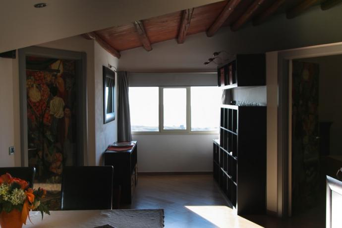 suite guttuso soggiorno con finestra panoramica