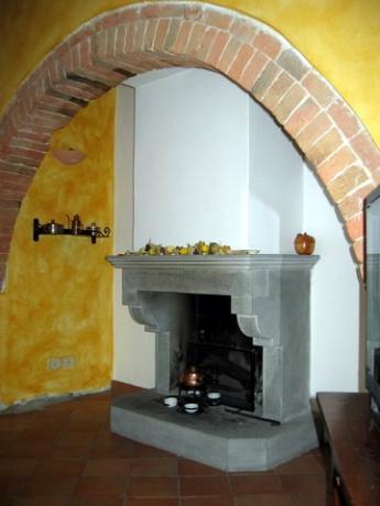 Detail of the living room with fireplace 