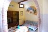 Stanze arredate in stile rustico