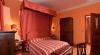 Camera con letto a baldacchino