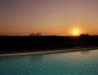 Piscina con tramonto a Castiglione del Lago